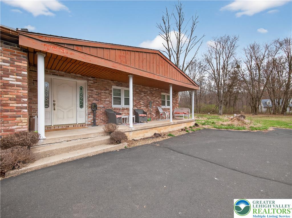 2197 Buck Run Road Quakertown, PA 18951 - Photo 16 of 45 Brick facade with a covered porch offers a welcoming entryway.