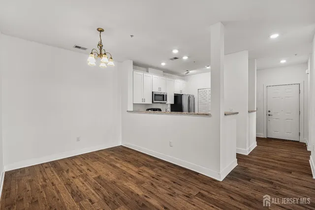 a view of a kitchen from the hallway