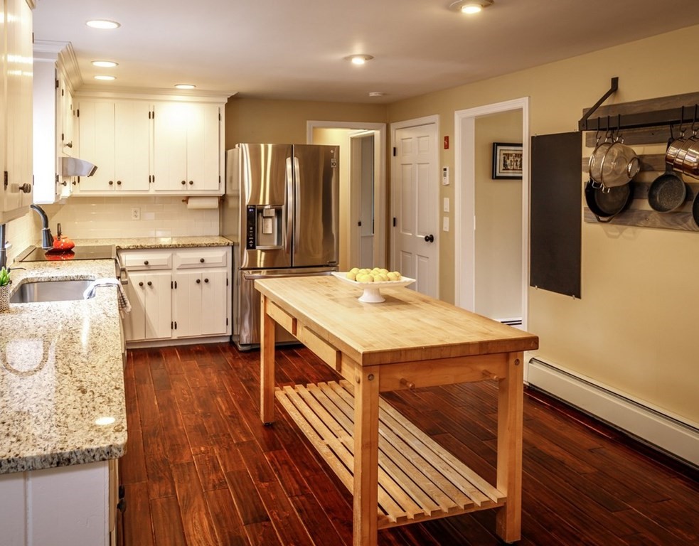 8 Olde Coach Road Westborough, MA 01581 - Photo 11 of 42 a kitchen with a sink appliances and cabinets
