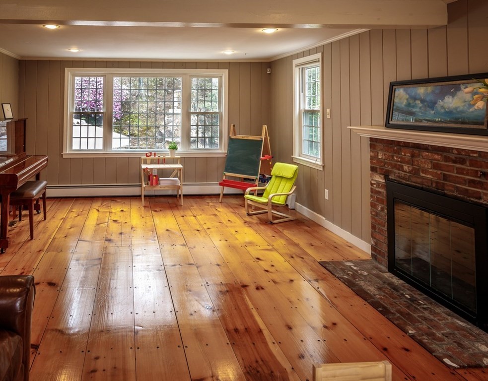 8 Olde Coach Road Westborough, MA 01581 - Photo 20 of 42 a living room with furniture and a fireplace