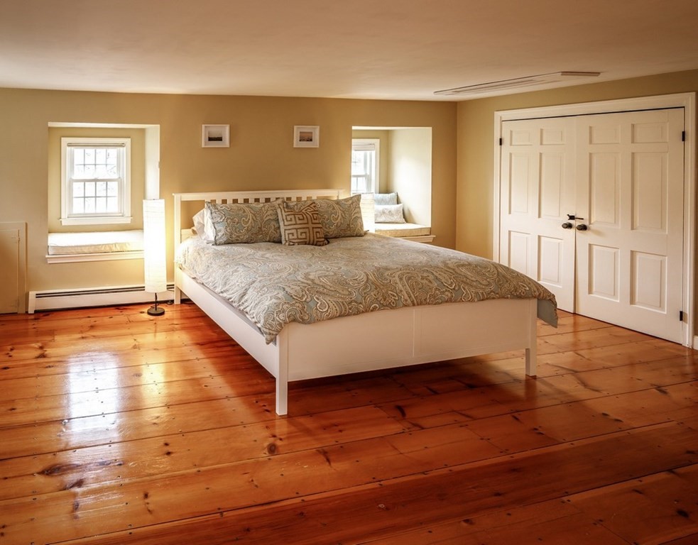 8 Olde Coach Road Westborough, MA 01581 - Photo 22 of 42 a spacious bedroom with a bed and wooden floor