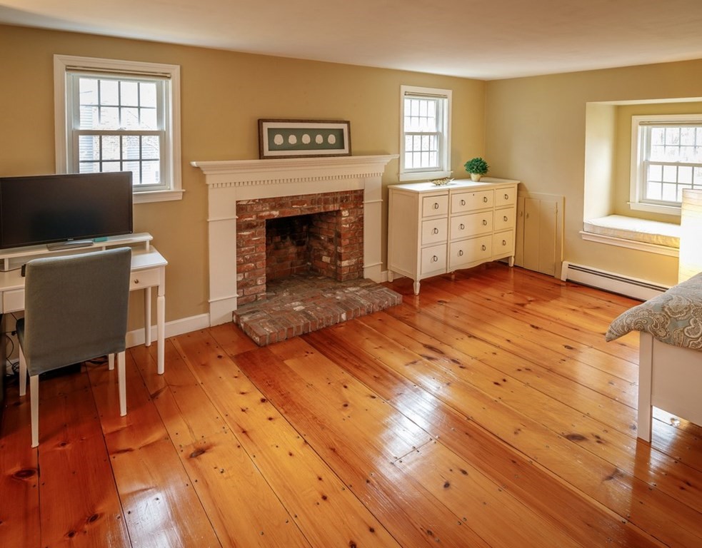 8 Olde Coach Road Westborough, MA 01581 - Photo 23 of 42 a living room with furniture and a fireplace
