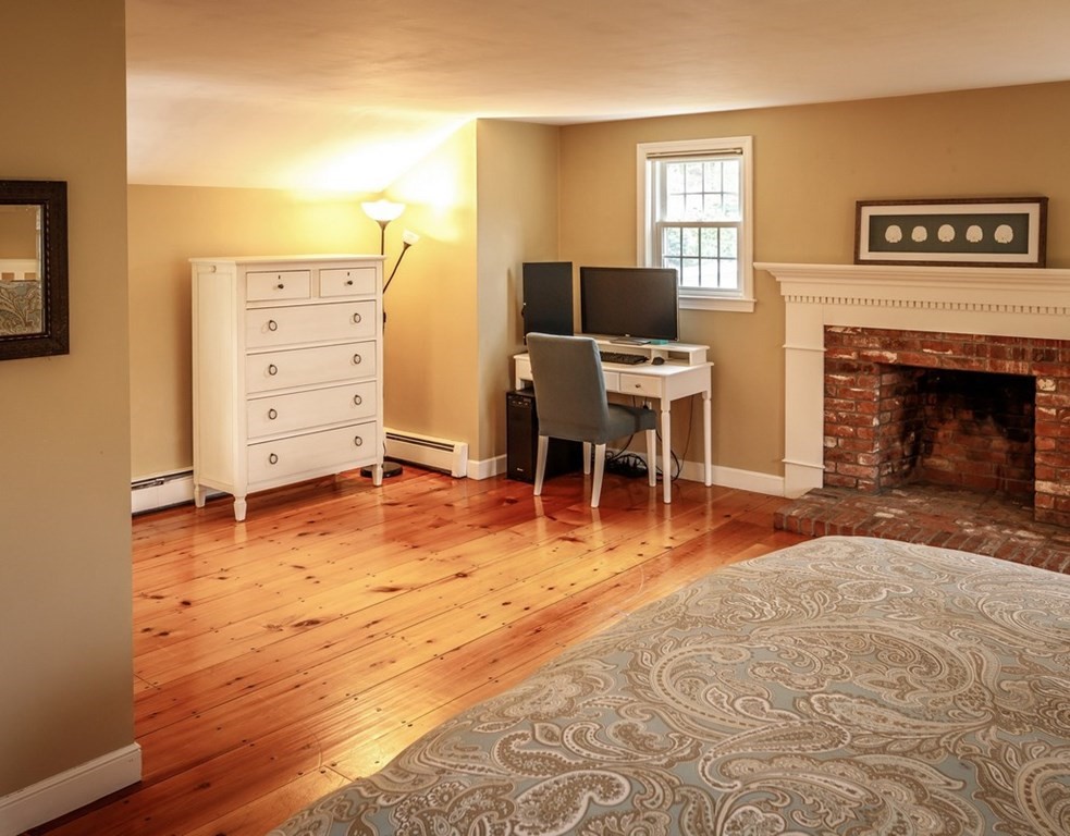 8 Olde Coach Road Westborough, MA 01581 - Photo 24 of 42 a room with furniture and a fireplace