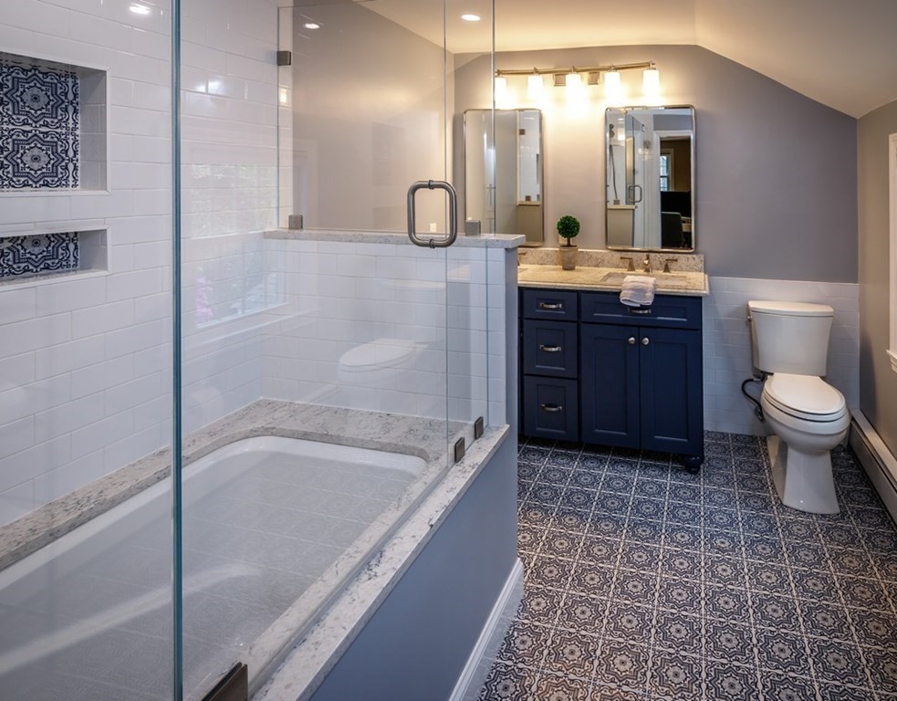 8 Olde Coach Road Westborough, MA 01581 - Photo 26 of 42 a bathroom with a bathtub sink mirror and toilet
