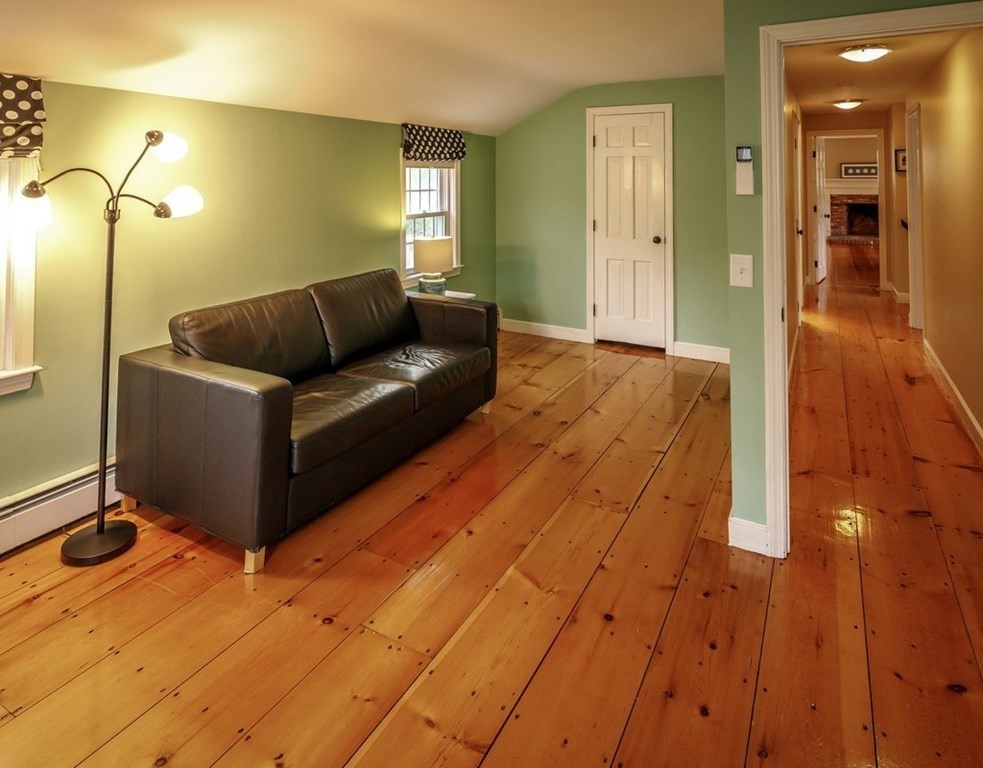 8 Olde Coach Road Westborough, MA 01581 - Photo 30 of 42 a living room with a couch and wooden floor