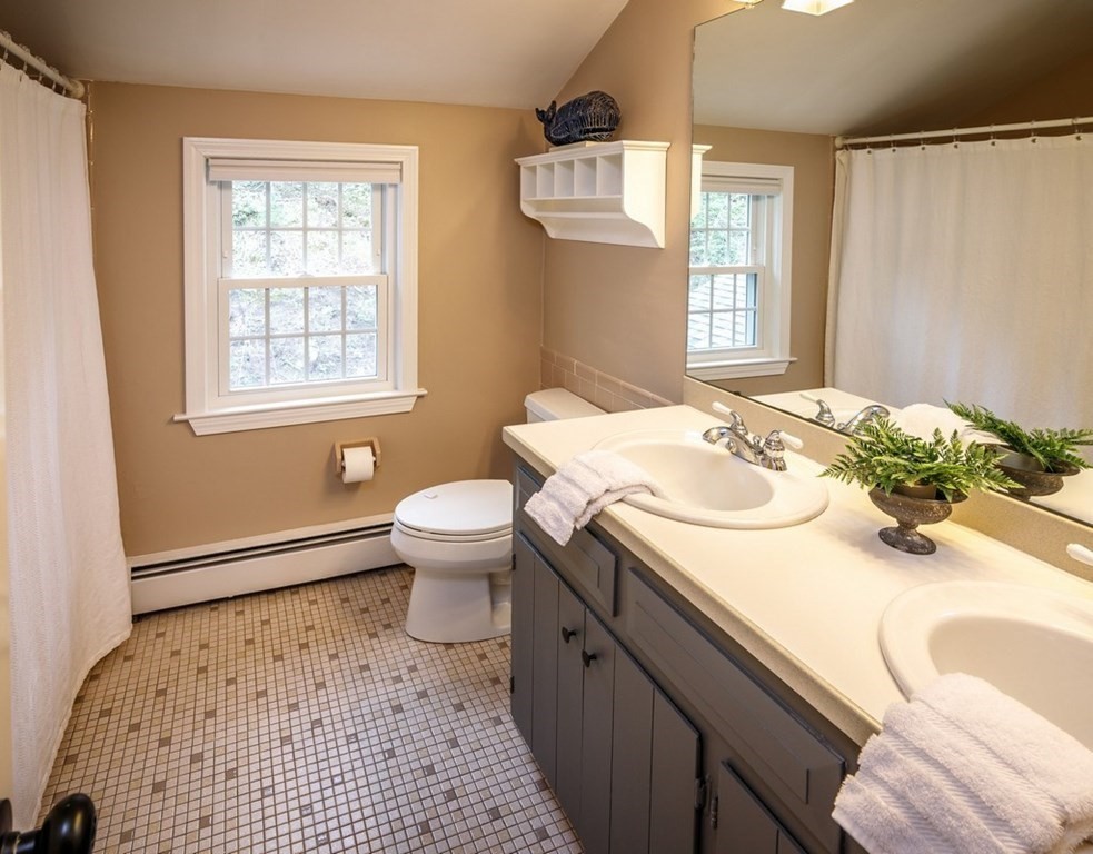 8 Olde Coach Road Westborough, MA 01581 - Photo 32 of 42 a bathroom with a sink toilet and window