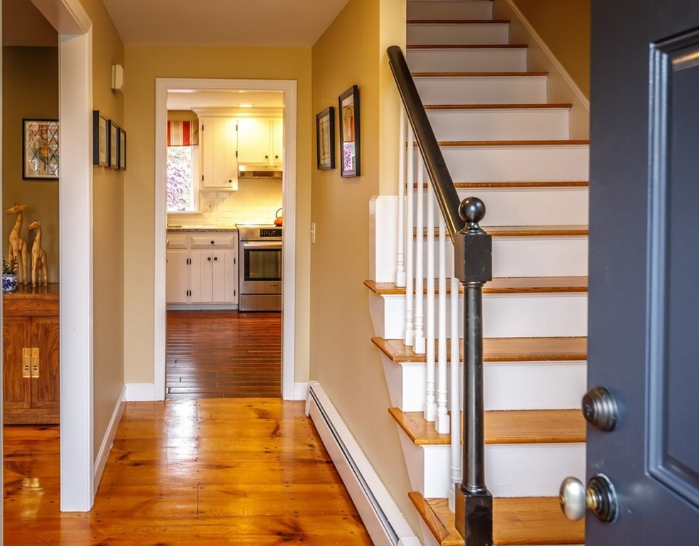 8 Olde Coach Road Westborough, MA 01581 - Photo 4 of 42 a view of a hallway with wooden floor and staircase