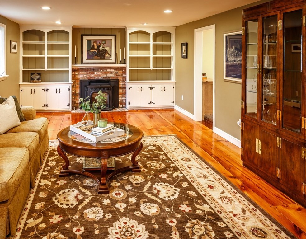 8 Olde Coach Road Westborough, MA 01581 - Photo 5 of 42 a living room with fireplace furniture and a fireplace
