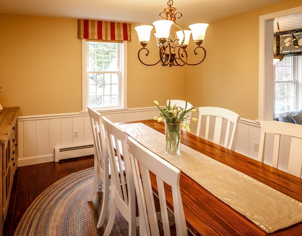 8 Olde Coach Road Westborough, MA 01581 - Photo 8 of 42 a view of a dining room with furniture a chandelier and a window