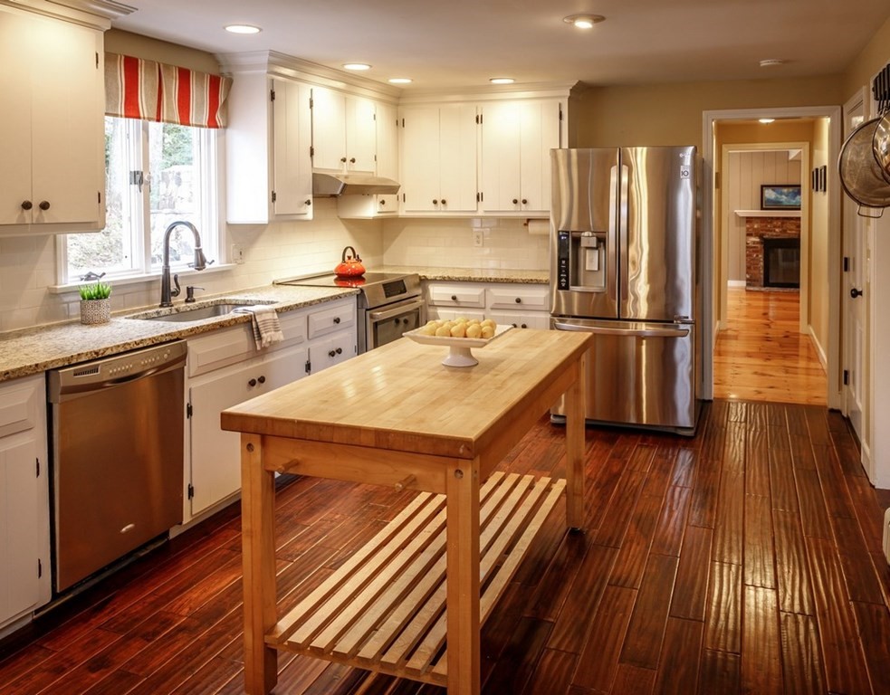 8 Olde Coach Road Westborough, MA 01581 - Photo 10 of 42 a kitchen with a sink a refrigerator and wooden floor