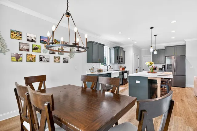 a view of kitchen with sink and wooden floor
