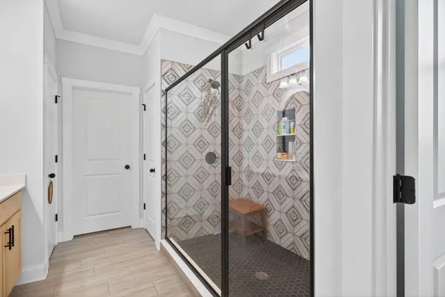 a view of walk in closet with clothes