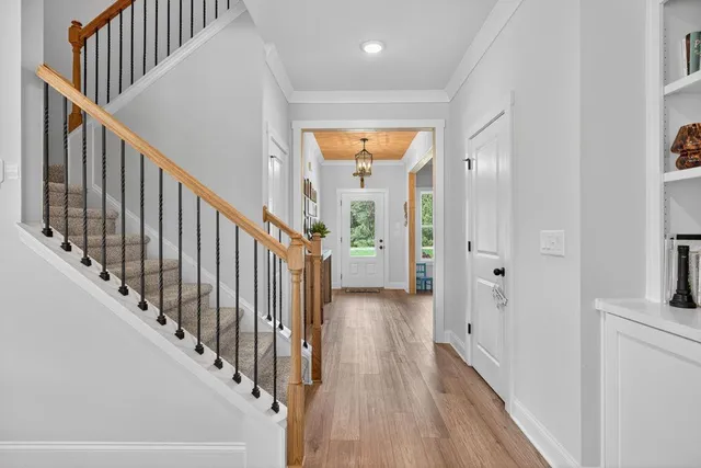 a view of a hallway with a door