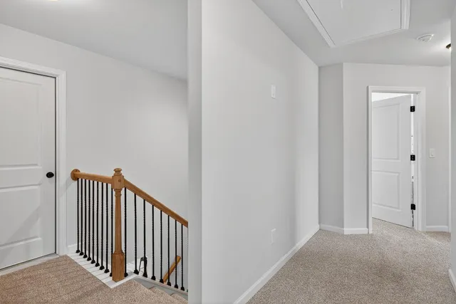 a bedroom with a bed and a mirror