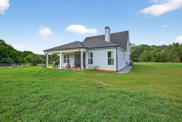 a view of park with wooden fence