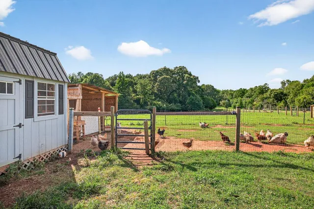 a view of a house with backyard and porch
