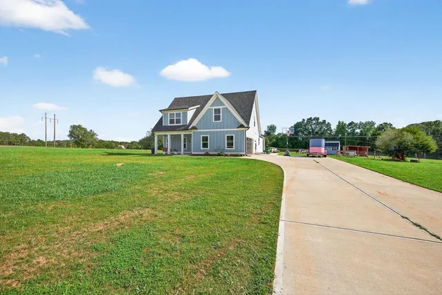 a room with pool table and chairs