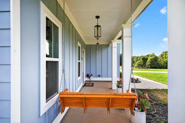 a green field covered with tall trees