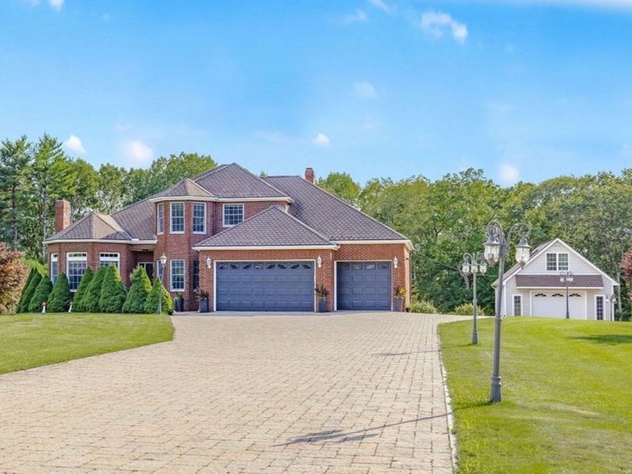 114 Upper Gore Road Webster, MA 01570 - Photo 1 of 40 a front view of a house with a garden and yard