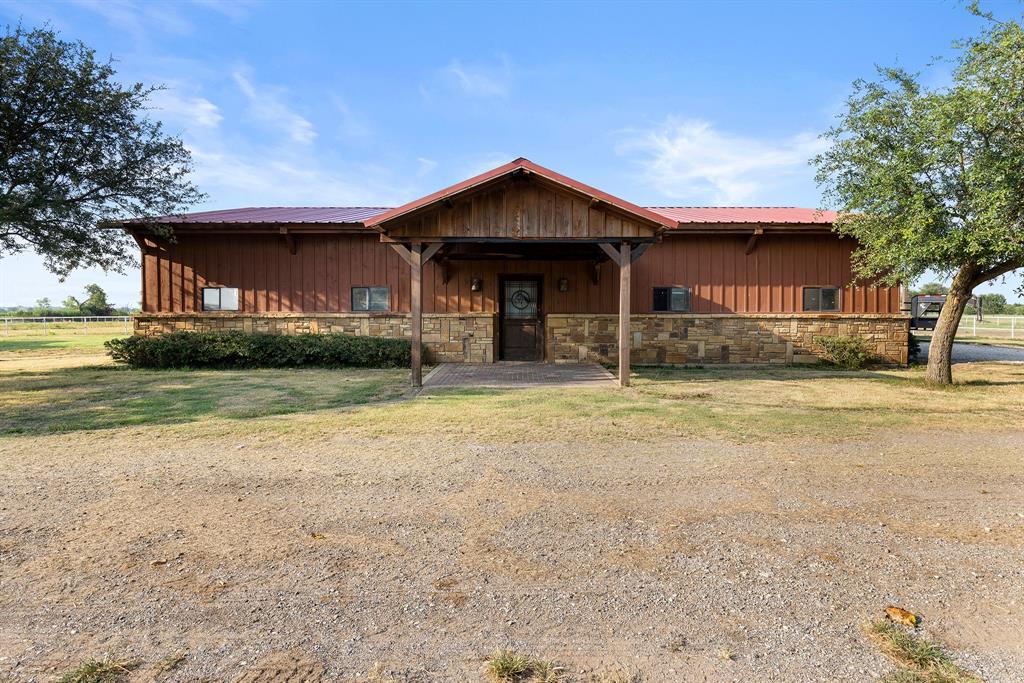 789 Stiles Road, Unit 789 Whitesboro, TX 76273 - Photo 19 of 34 Chalet / cabin with stone siding, covered porch, a metal roof, and board and batten siding