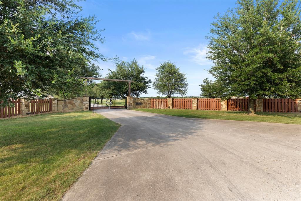 789 Stiles Road, Unit 789 Whitesboro, TX 76273 - Photo 30 of 34 View of concrete surface with a gate and a gated entry