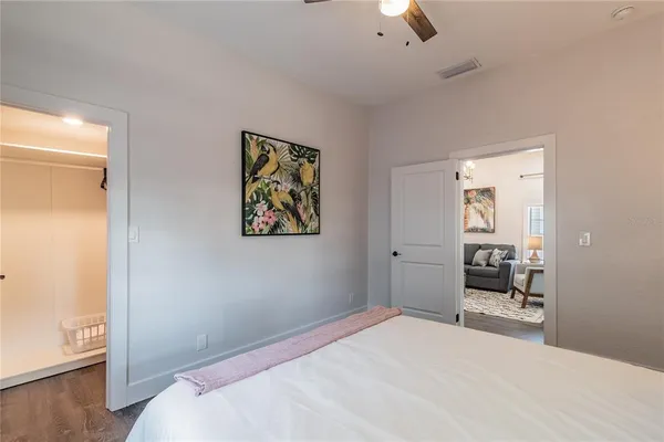a bedroom with two beds and white walls