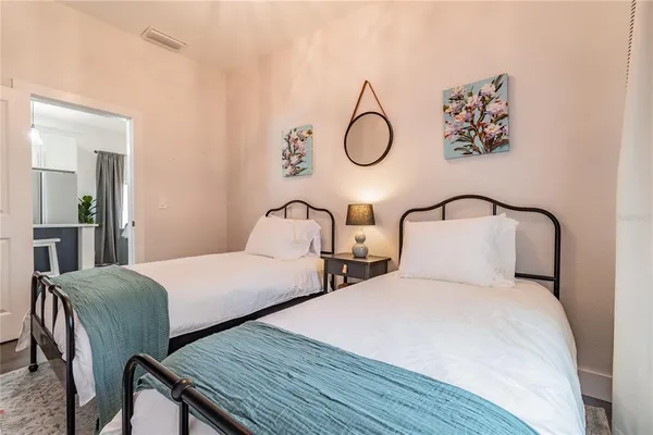 a bedroom with bed and a window