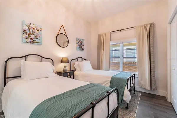 a kitchen with stainless steel appliances granite countertop a table chairs stove refrigerator and cabinets