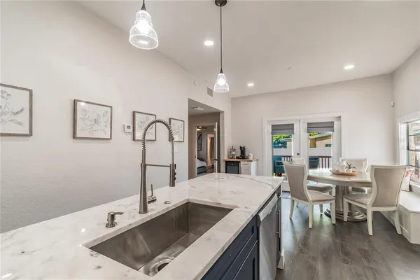 a dining room with furniture and window