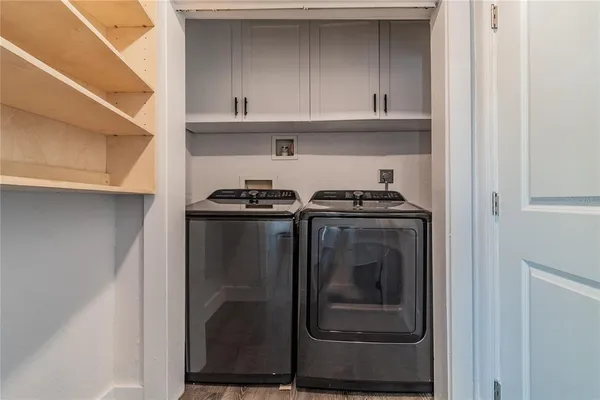 a view of a balcony with furniture