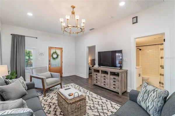 a living room with furniture and a flat screen tv
