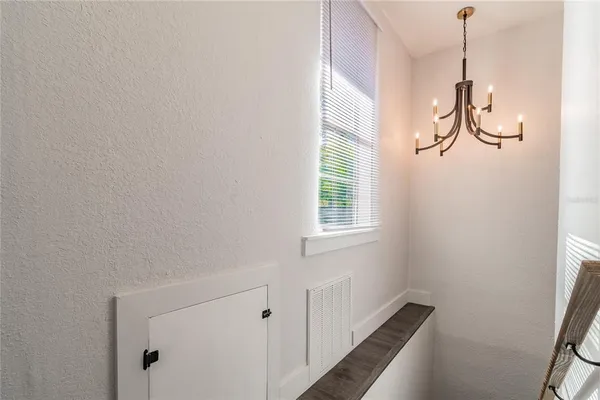a en suite bathroom with a granite countertop sink and a mirror