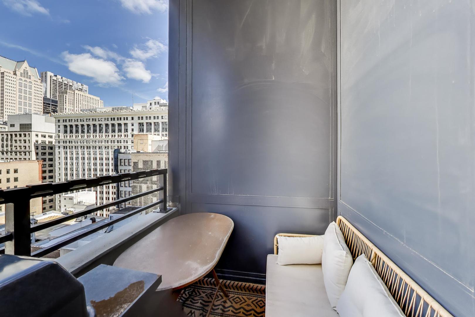 235 West Van Buren Street, Unit 2017 Chicago, IL 60607 - Photo 15 of 19 a view of a balcony with furniture