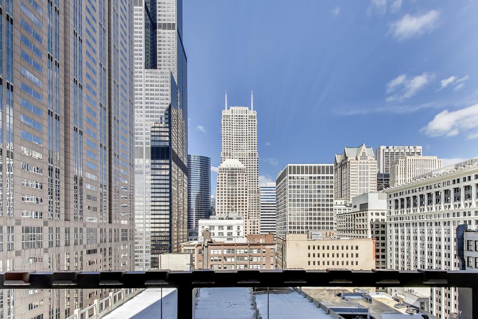 235 West Van Buren Street, Unit 2017 Chicago, IL 60607 - Photo 16 of 19 a view of a city with tall buildings