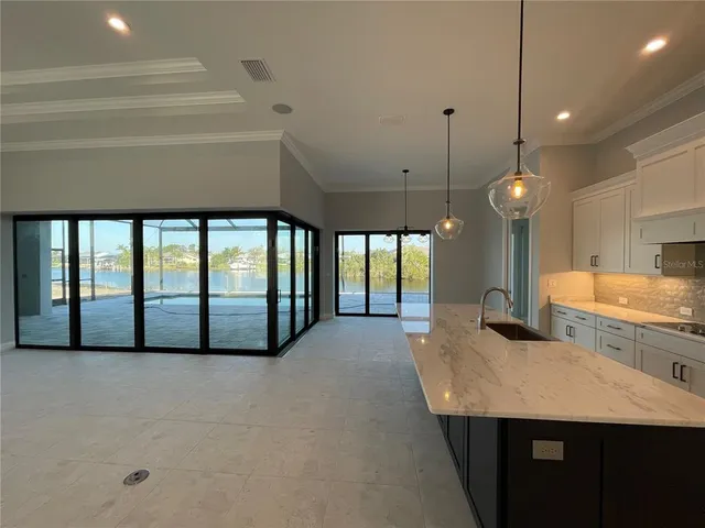 a spacious bathroom with a large tub and sink