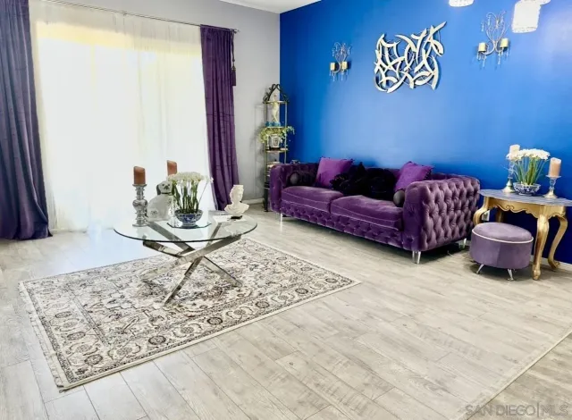 a living room with furniture and a rug