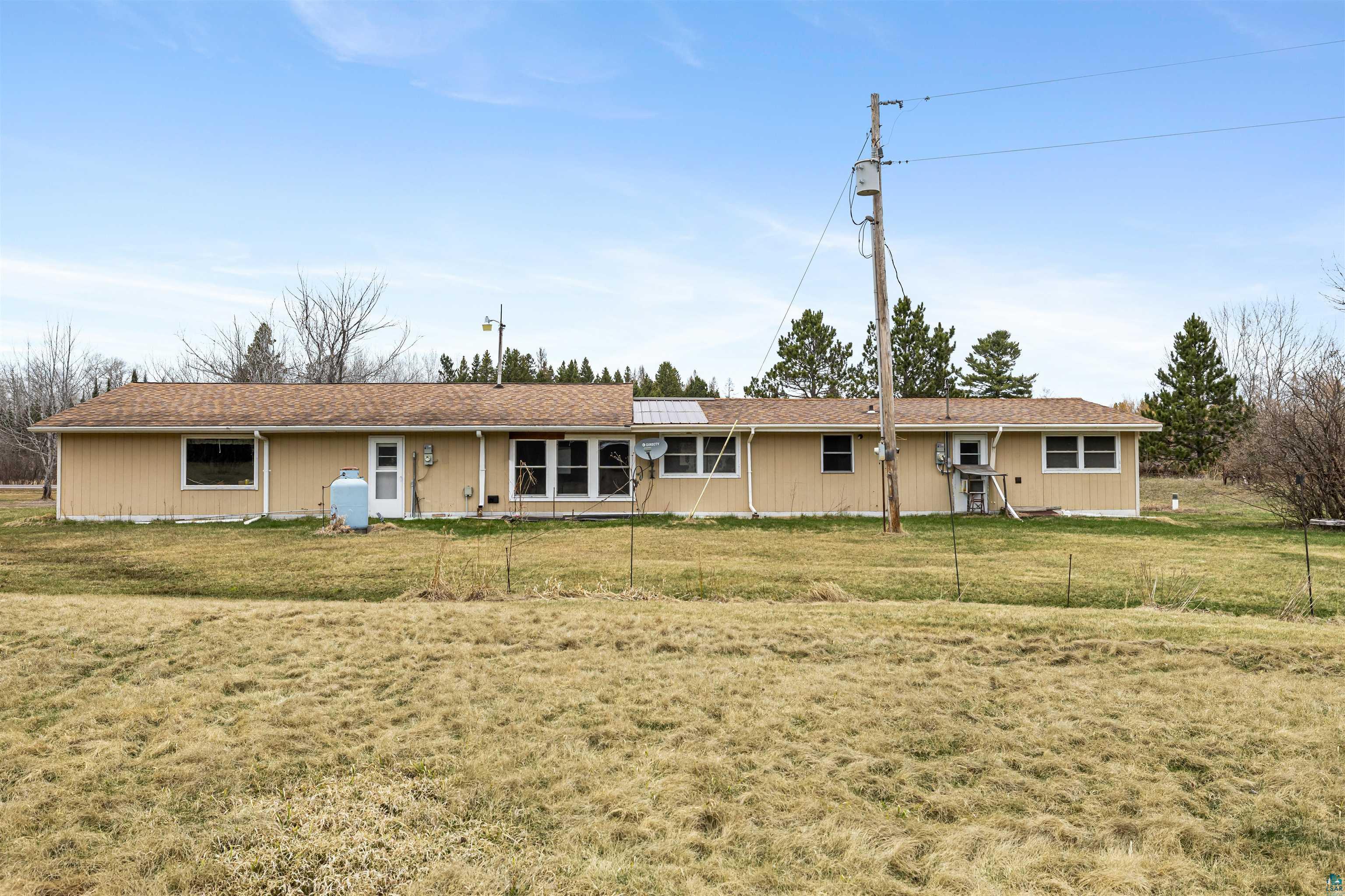 11574 Town Line Road Hibbing, MN 55746 - Photo 29 of 41 Ranch-style exterior with beige siding and a brown shingle roof