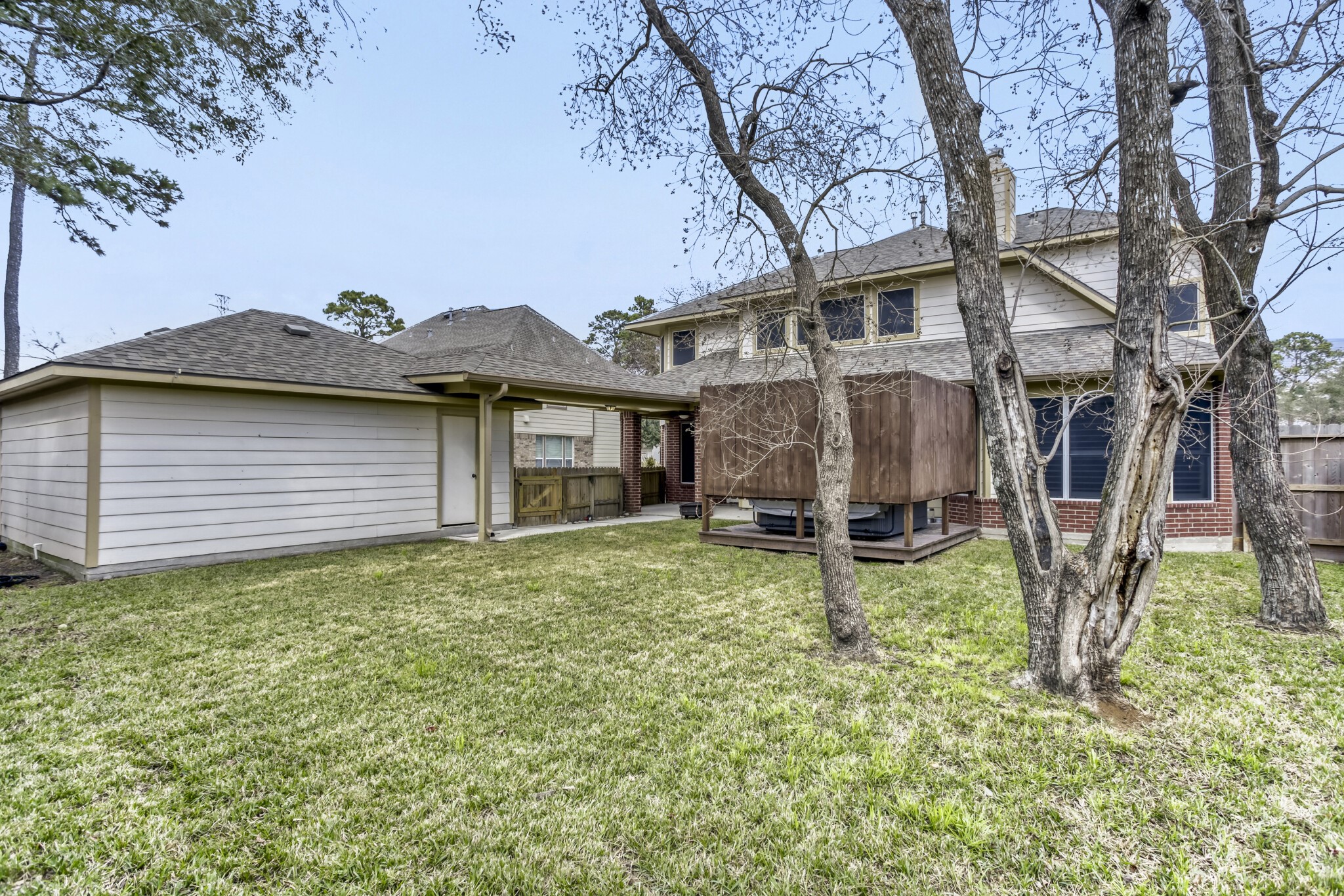 19303 Valiant Woods Drive Spring, TX 77379 - Photo 26 of 27 Discover a spacious and inviting backyard oasis, perfect for relaxation and outdoor gatherings.