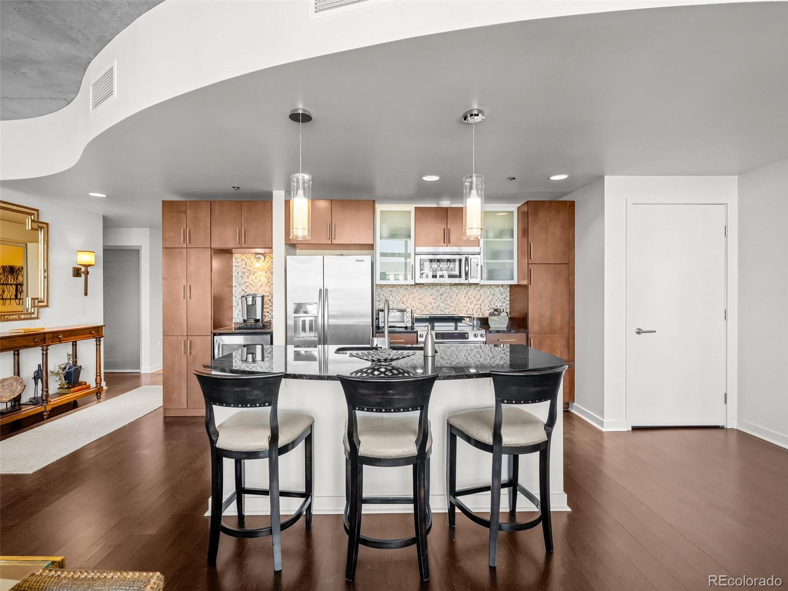 891 14th Street, Unit 3510 Denver, CO 80202 - Photo 7 of 50 a view of a dining room with furniture and wooden floor