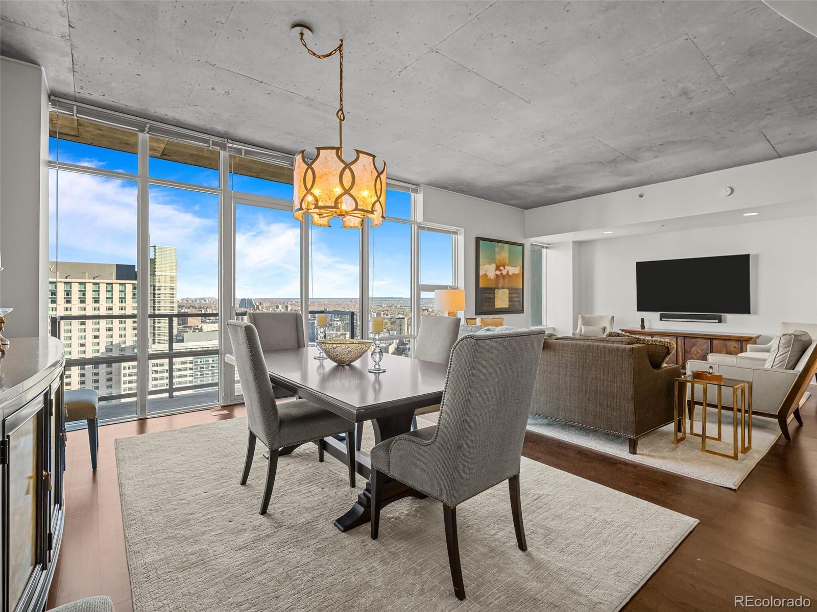 891 14th Street, Unit 3510 Denver, CO 80202 - Photo 10 of 50 a view of a dining room with furniture window and wooden floor