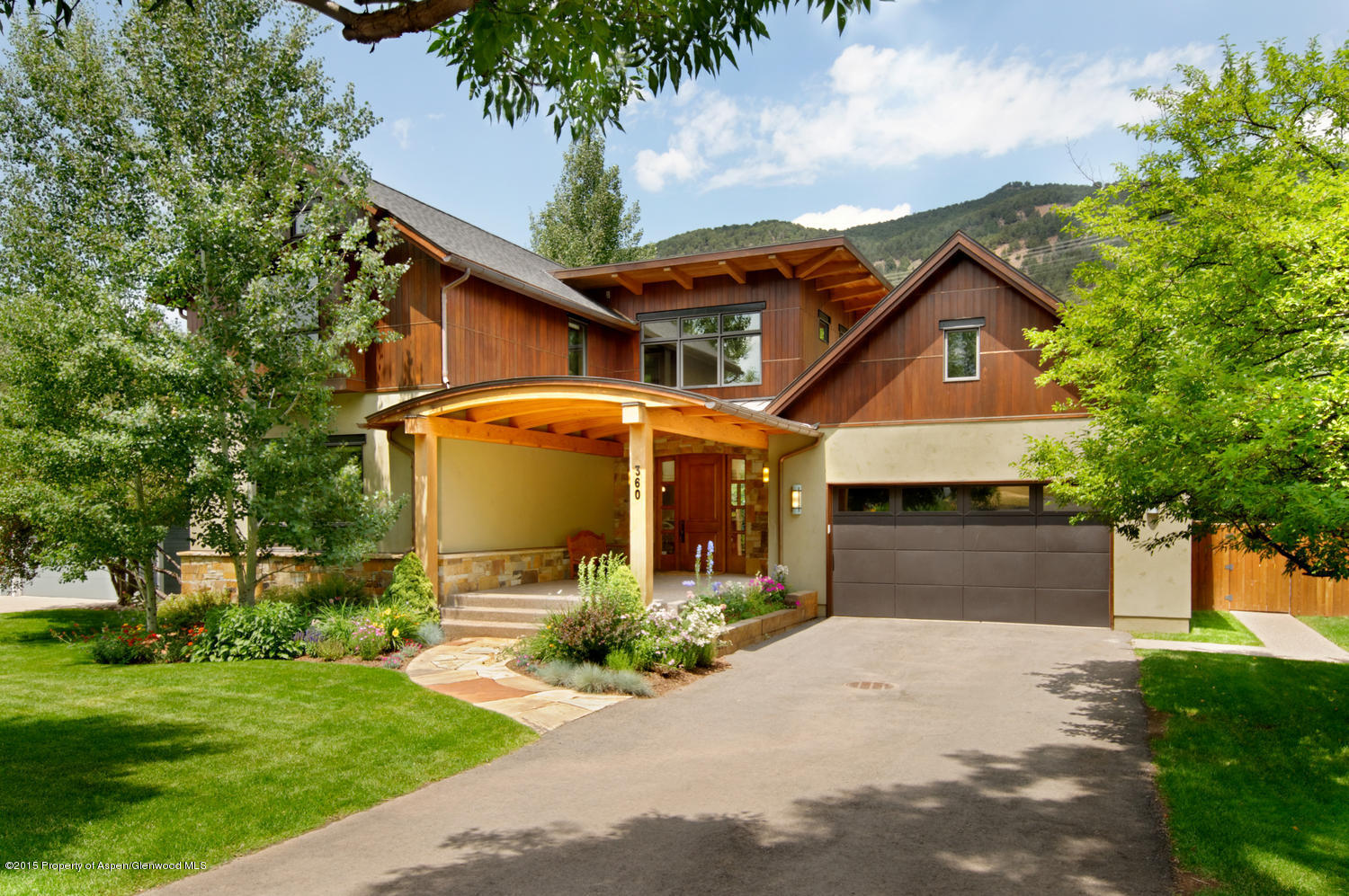 360 Riverside Drive Basalt, CO 81621 - Photo 1 of 29 a front view of a house with garden