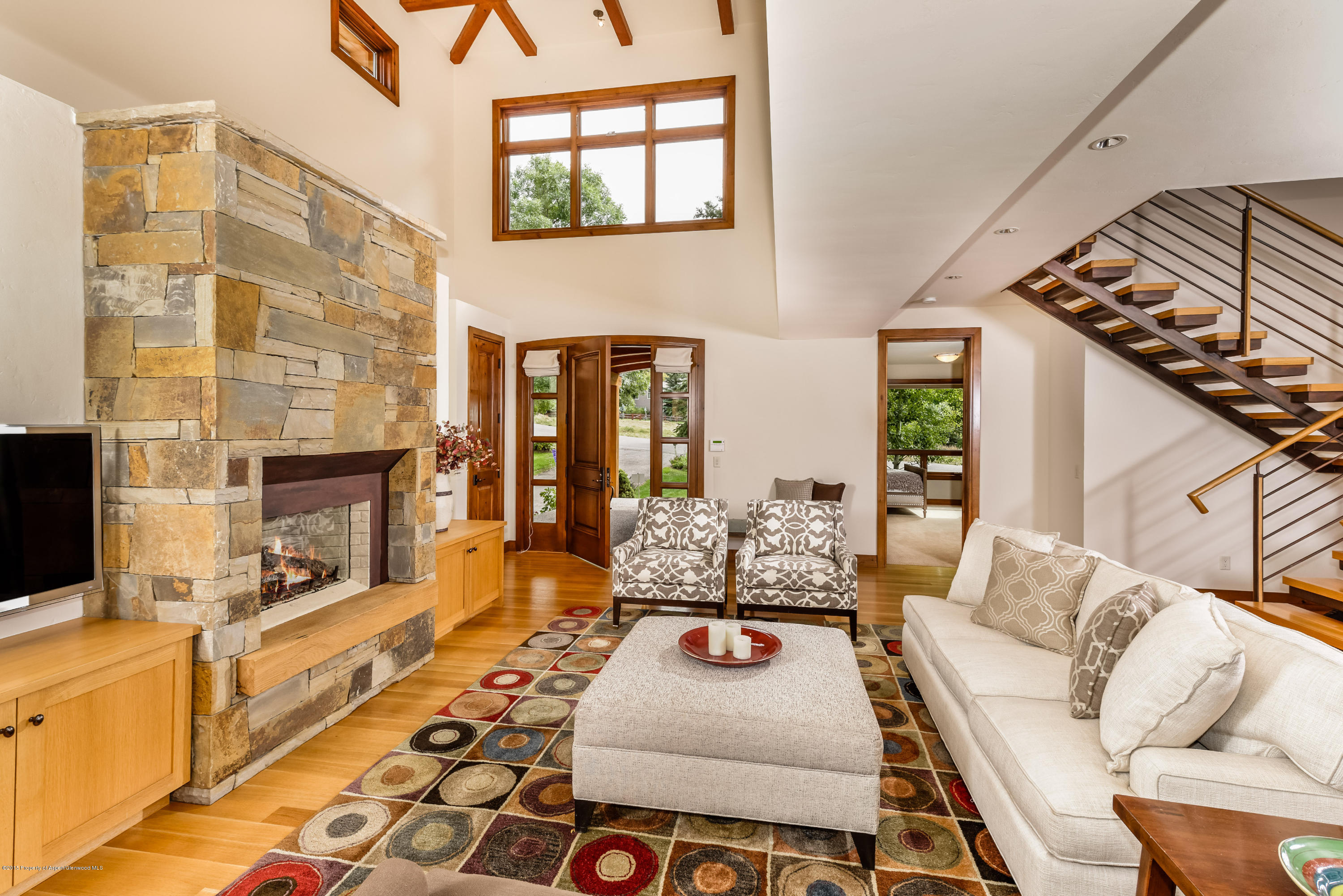 360 Riverside Drive Basalt, CO 81621 - Photo 5 of 29 a living room with furniture and a fireplace