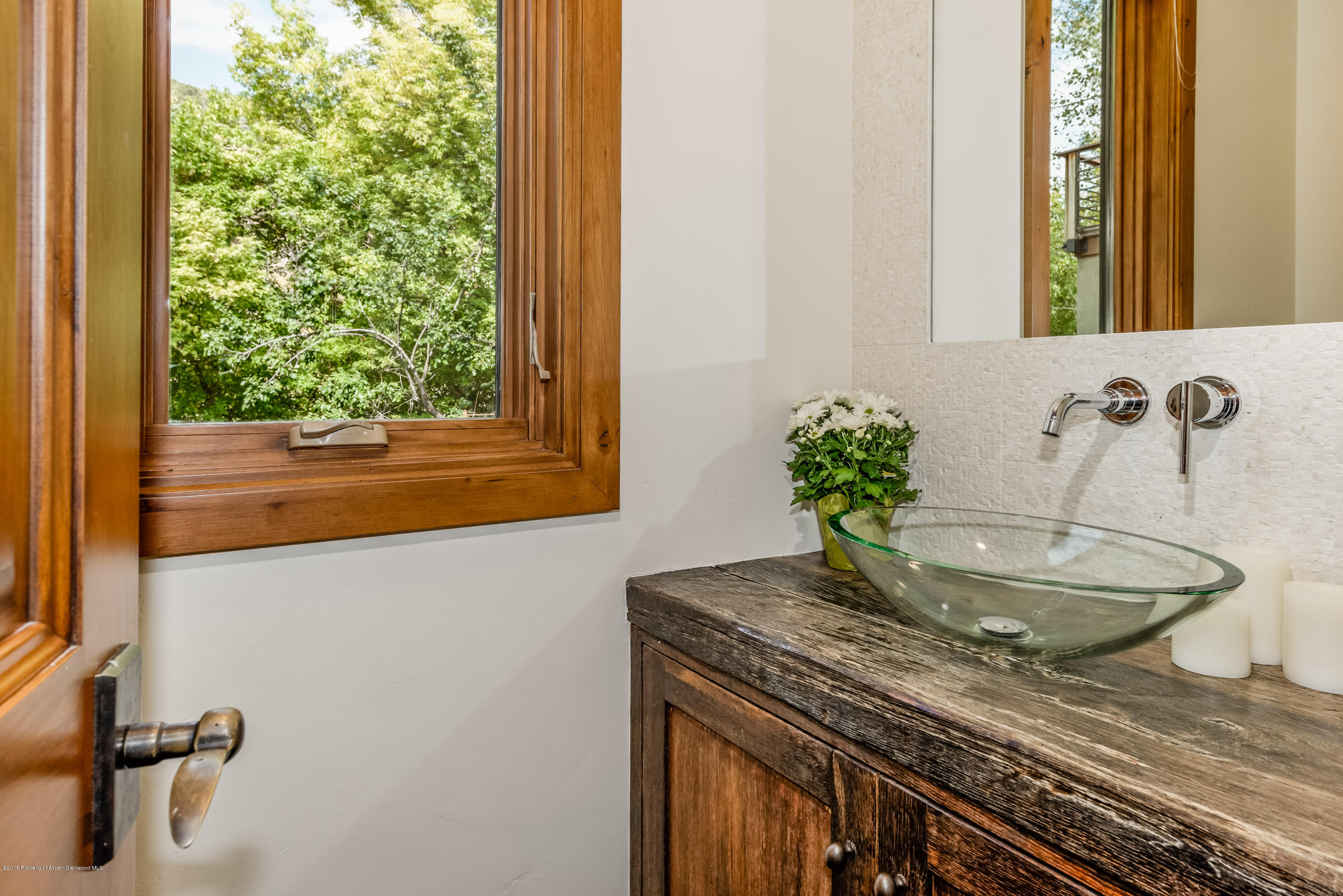 360 Riverside Drive Basalt, CO 81621 - Photo 9 of 29 a bathroom with a granite countertop sink and a mirror