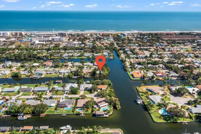 an aerial view of residential building with outdoor space ocean view