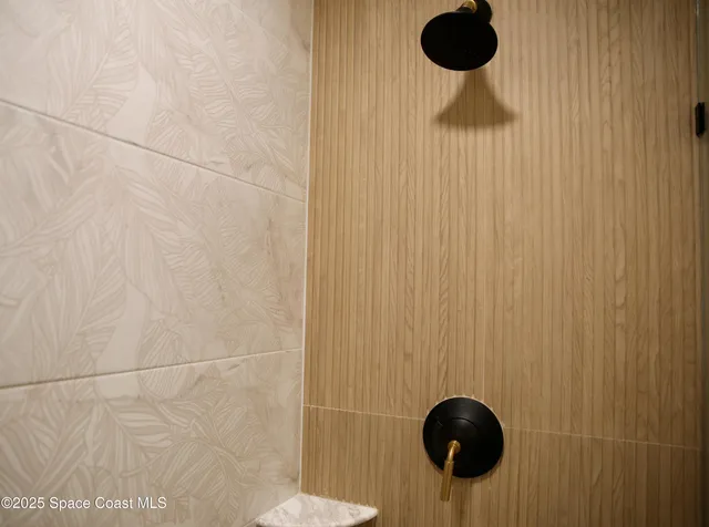 a blue bed sitting in a bedroom next to a window