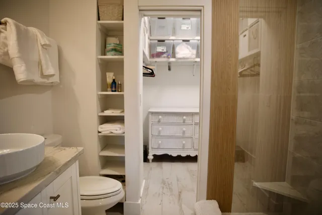 a bathroom with a sink and a large mirror