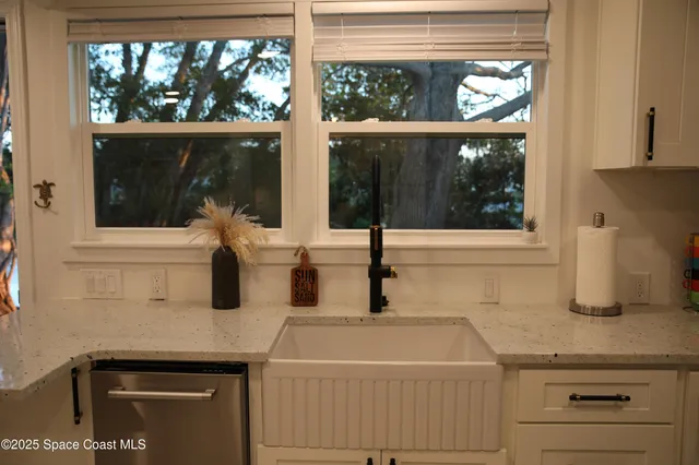 a view of front door with a house