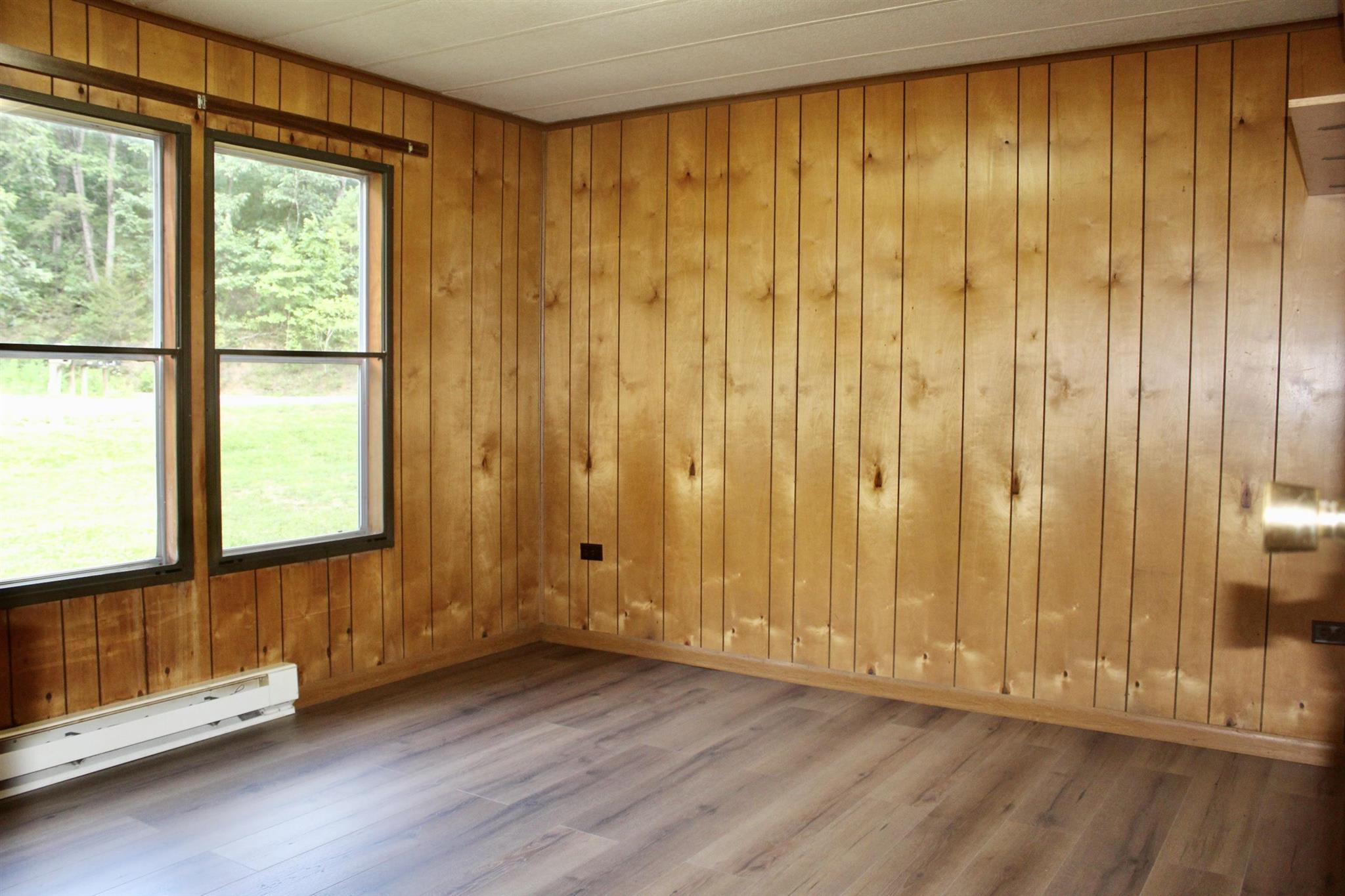 10331 Union Springs Road Dayton, VA 22821 - Photo 8 of 10 wooden floor in an empty room with a window