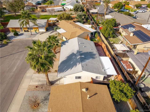 an aerial view of residential houses with outdoor space
