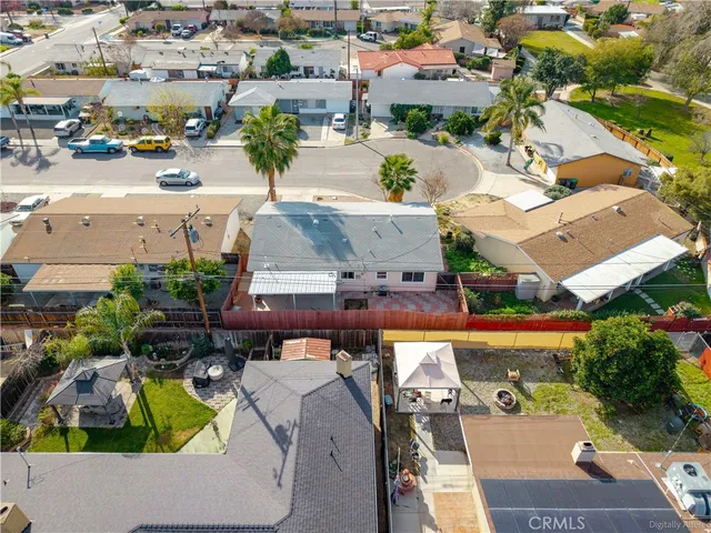 an aerial view of a house with a swimming pool